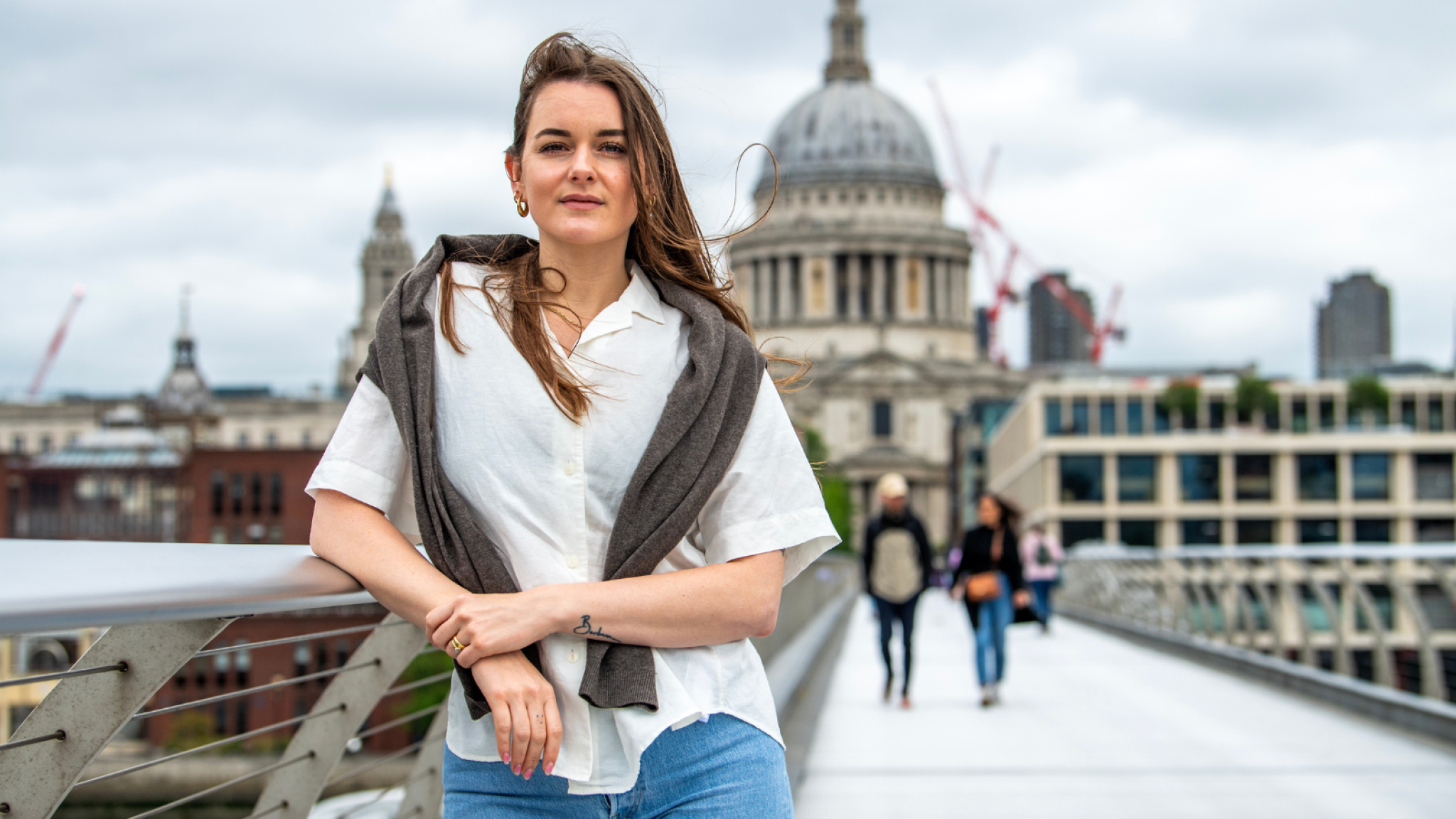 Cecilia Knapp on Millennium Bridge, with St Pauls in the background.