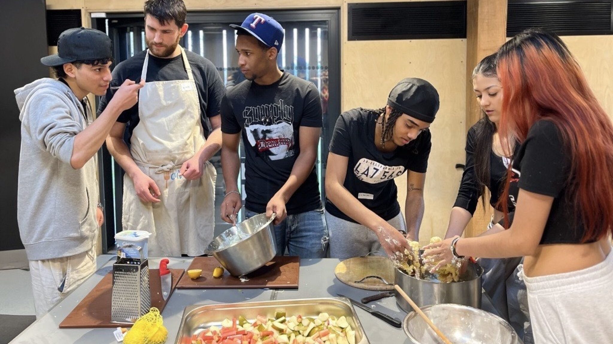 Young people from the King's Trust preparing food