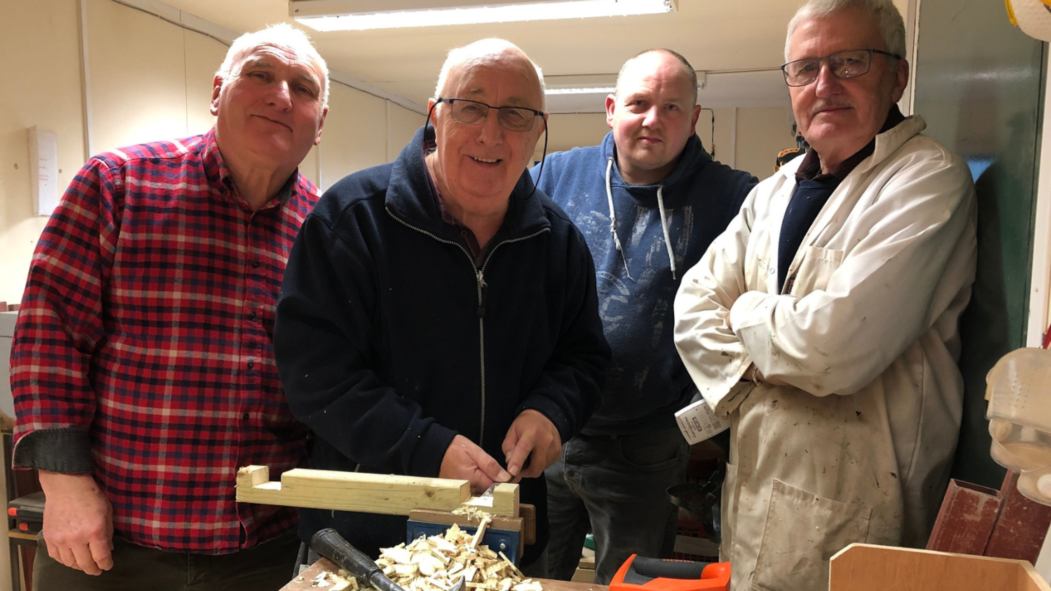 Men doing woodwork at a men's shed