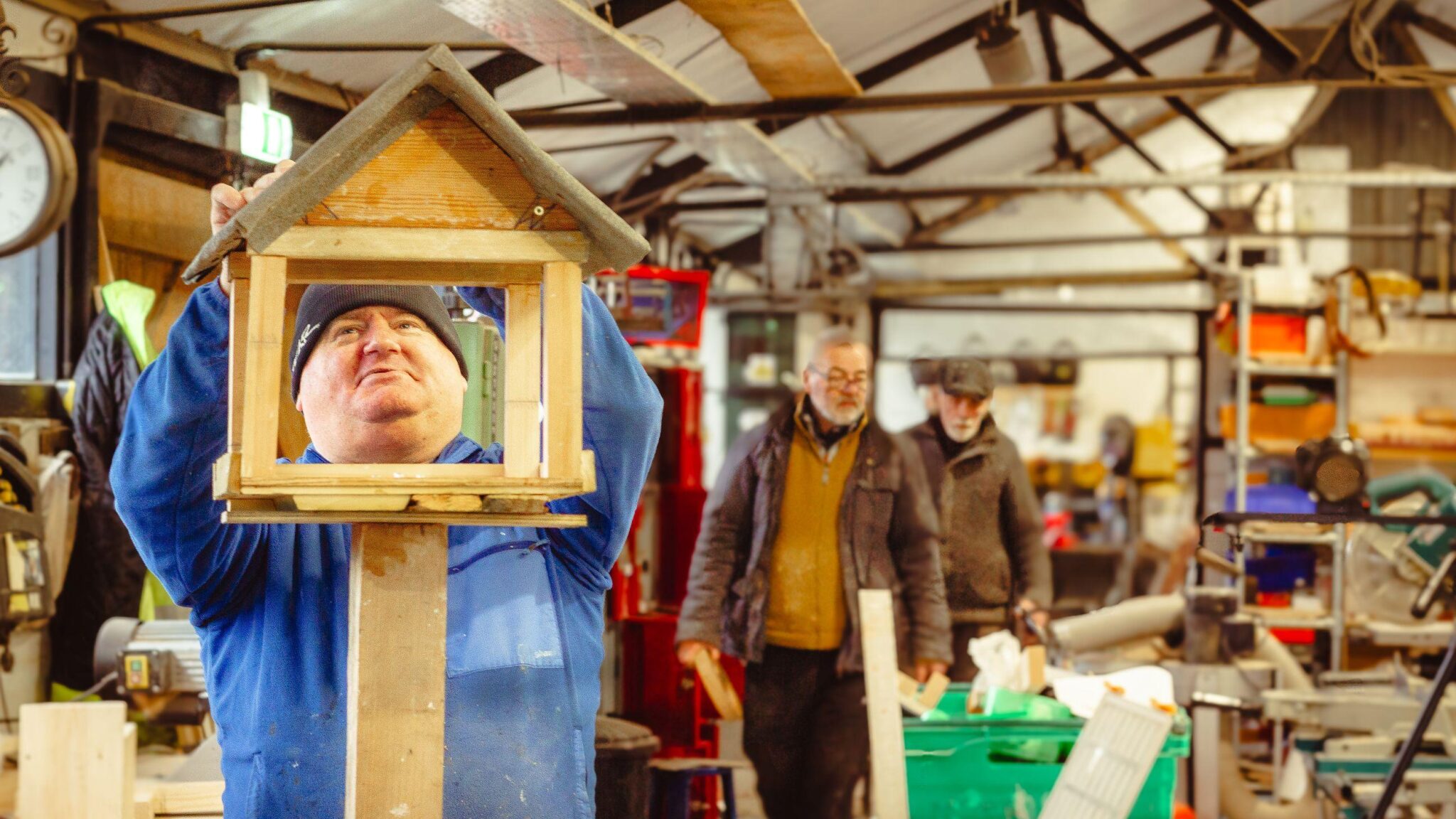 Men doing woodwork at a men's shed