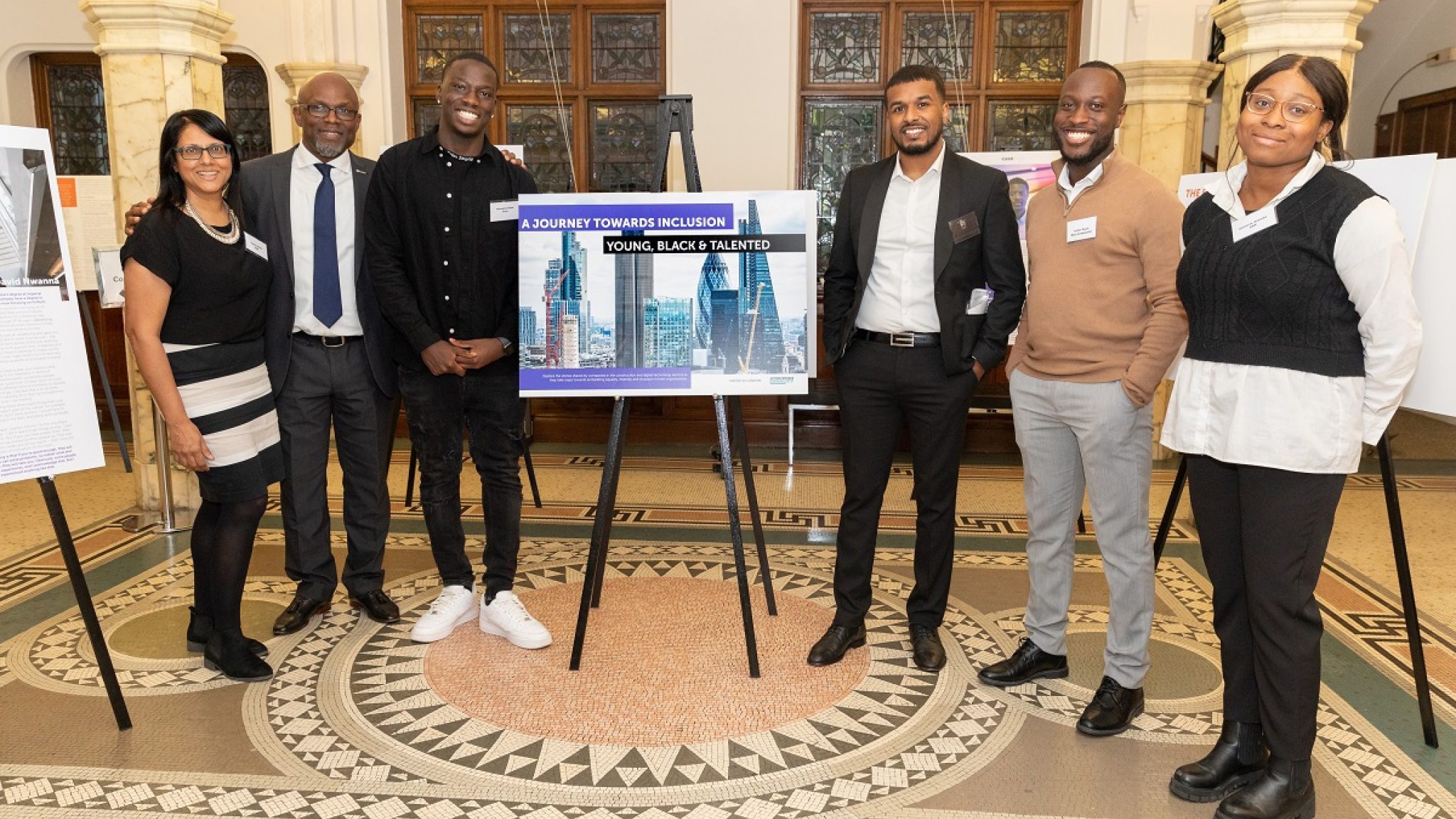 Moving on Up ambassadors with Tottenham poet, Giovanni Rose, at A Journey Towards Inclusion: Young, Black Talented, hosted by Action for Race Equality’s flagship employment programme, Moving on Up, the Mayor of London and RICS in Westminster (pic – Raj Ghedu)